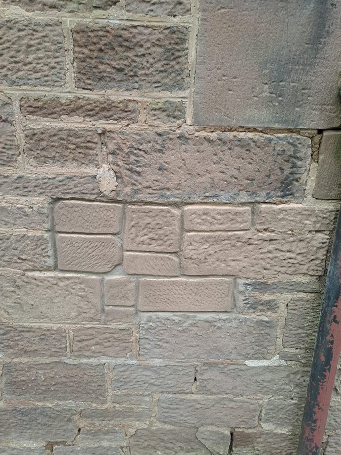 Replacement sandstone matched to a traditional façade