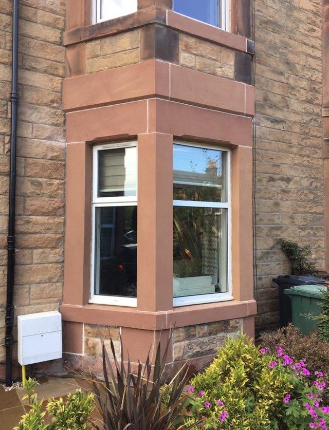 Sympathetically restored sandstone bay window
